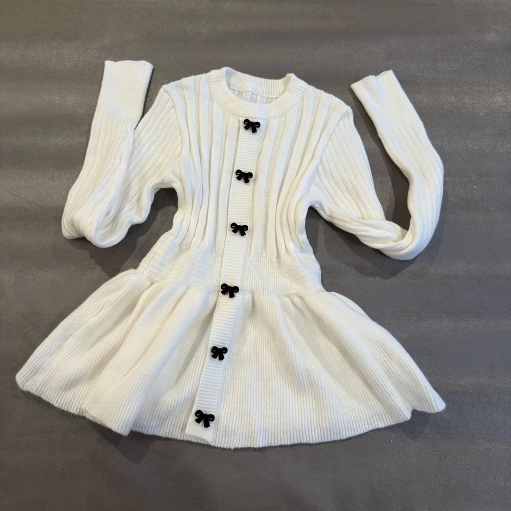 Charming White Knit Sweater  with Black Accents bow ties.